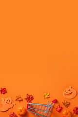 Creative Halloween design concept background with pumpkin, autumn leaves and copy space.