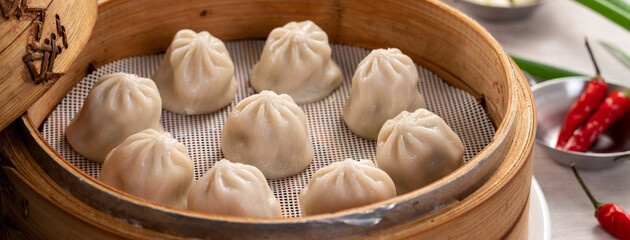 Steamed pork soup dumplings named Xiao long bao in Taiwan.