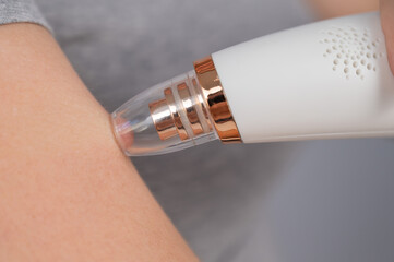 Close-up of a vacuum skin cleaner at home.