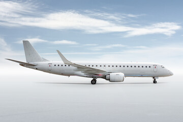 White passenger aircraft isolated on bright background with sky