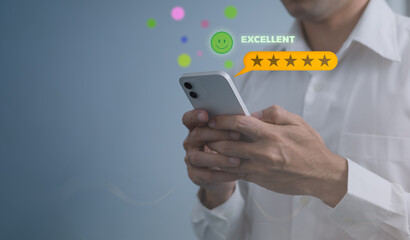 Customer Satisfaction service and Satisfaction concept ,Business people are touching the virtual screen on the happy Smiley face icon to give satisfaction in service. rating very impressed.