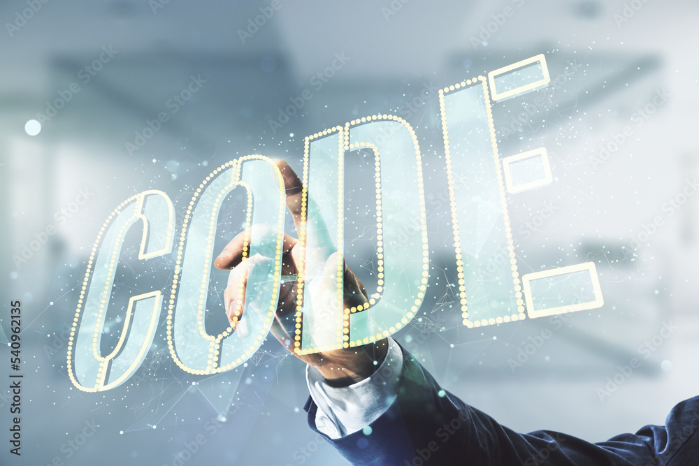 Aufkleber man hand presses on code word hologram on blurred office background, international software developm