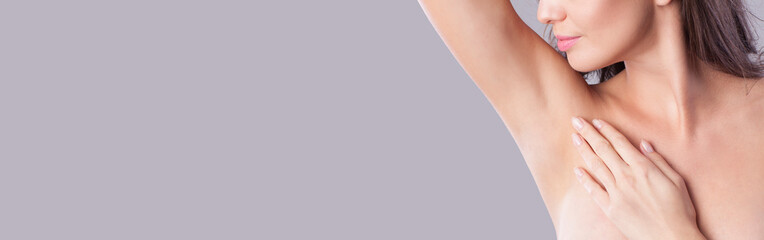 Obraz na płótnie Canvas Close up of female armpit. Model touching her axilla.