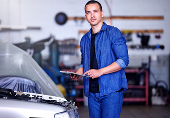 Car, clipboard and portrait of a mechanic at his workshop doing a motor inspection with a checklist. Engineering, industrial and man working on vehicle for engine maintenance, repair or fix in garage