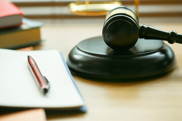 Lawyer or judge's hammer in the court. Auction's hammer and judgement golden scale are on wood...