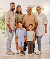Happy family portrait with kids, parents and grandparents with smile standing in brazil home....