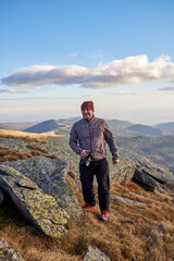 Fototapeta premium male photographer on the top of the mountain