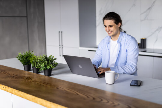 Freelancer man working at home drinking coffee from home