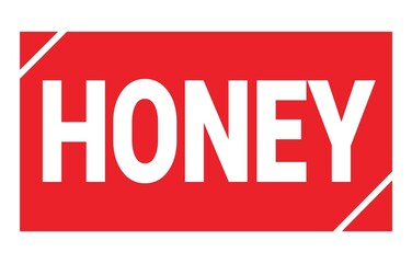 Fototapeta premium HONEY text written on red stamp sign.