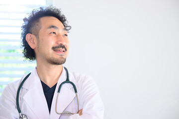 Asian doctor in a white coat.