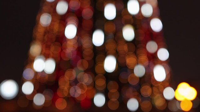 Bright multi-colored flickering lights close-up. Abstract holiday background.