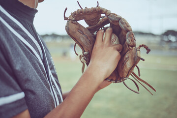Baseball player, hands or ball in mitt on grass field for fitness, workout and training in game,...
