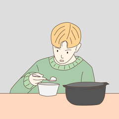 child eating soup