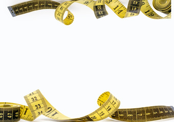 Yellow measuring tapes on a white background. Tool for measuring length and volume. Yellow-black...