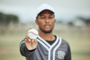 Baseball in hand, baseball player and athlete on field training for sports competition. Young black...