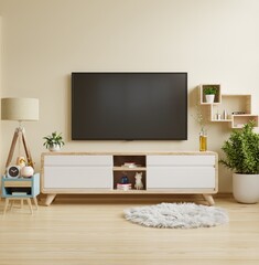 Cream color wall mounted tv on cabinet in living room,minimal design.
