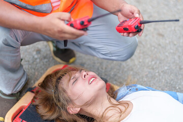 An injured woman in a plastic stretcher after a car accident ,Car accident insurance concept