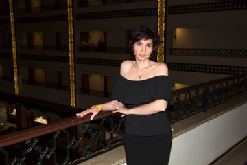 Portrait of a woman in a black dress theater.