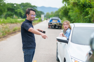 Two drivers having argument over who is guilty in car crash accident. Road safety and insurance concept