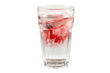 Tea glass filled with hibiscus herbal tea on the white table,Herbal tea of hibiscus, hot herbal tea for winter