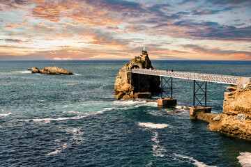 Pretty seaside landscape of Biarritz and its famous rock of the Virgin at sunset
 - obrazy, fototapety, plakaty