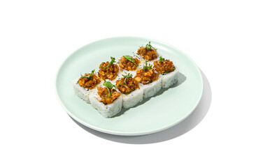 Sushi topped salmon tartare and micro greens Maki sushi with salmon in teriyaki sauce on ceramic plate. Salmon maki top tartare isolated on white background with hard shadow