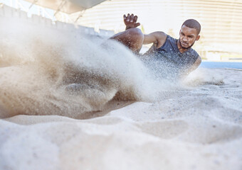 Man, athlete and sand for long jump, sport and training for sports, field and global competition....