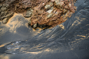 rocks in the black beach