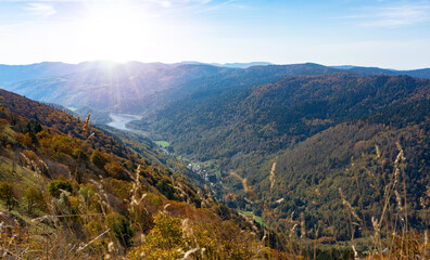 autumn valley view in the mountains with sunlight