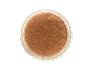 Top view of Cocoa powder in a glass bottle on white background.