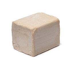 Fresh yeast cube isolated on white background close up
