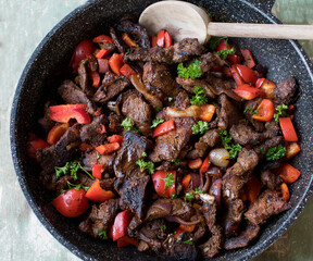 Beef stir fry with vegetables in a frying pan