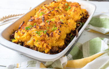 Ground beef pumpkin casserole on white background