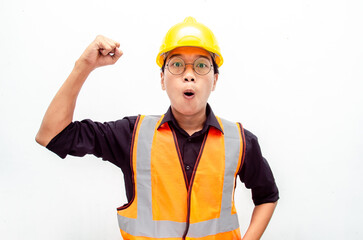 Happy ecstatic young Asian male construction worker, engineer, builder raising his fists doing yes gesture celebrating success. billboard model advertisment concept. 