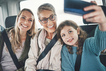 Girl, mother and grandmother in car selfie with phone, road trip and transport with picture for...