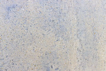 close up texture of smooth blue and yellow stone wall