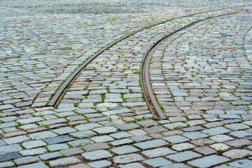 Rails passing through the paving stones in the city. Suddenly ending tram tracks. End of the...