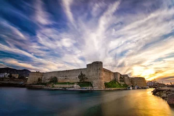 Gordijnen Cyprus, Kyrenia castle and magnificent clouds, sunset over the castle © yakupyener