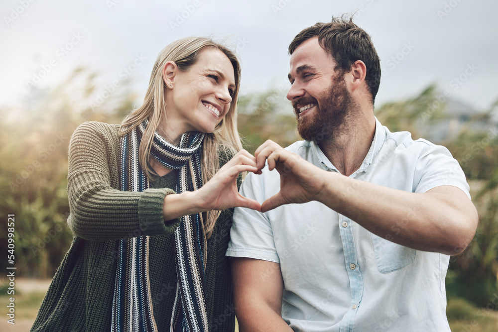 Poster Couple, hands and smile with love gesture for happy relationship bonding and care in the outdoors. Hand of man and woman smiling together in happiness with heart shape sign for romance in nature park