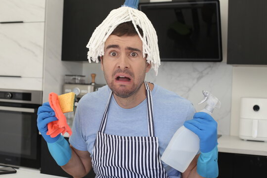 Chaotic Man Trying To Clean The Kitchen 