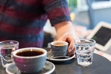Barista preparing coffee at cafe