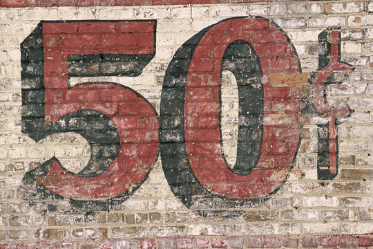 Fifty Cent sign painted on a building.