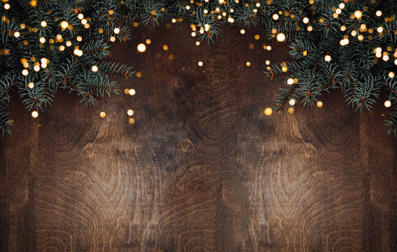 Spruce branch on a wooden background