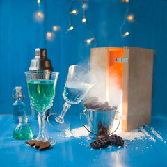 wine glasses with colorful liquid and smoke. shades of blue. Wine bar, wine shop, crazy party