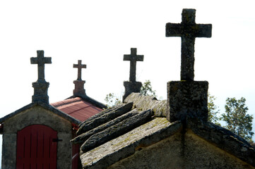 Ancient stone storage buildings for grain (also called espiguerios) that have crosses on both ends in Lindoso, Portugal.