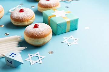 Jewish Holiday Hanukkah Card. Hanukkah Doughnuts Sufganiyot on Blue background.
