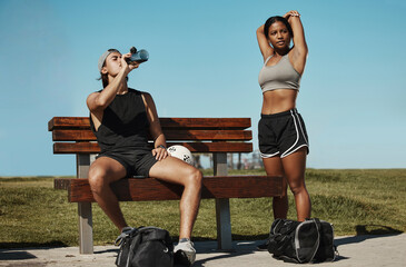 Man, woman and fitness break for stretching, drinking water or muscle recovery after training,...