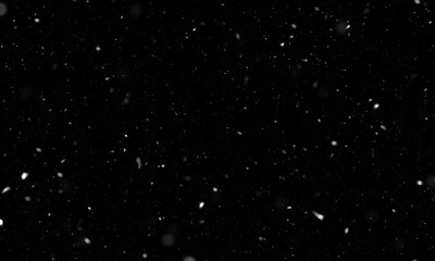 Falling snow isolated on black background