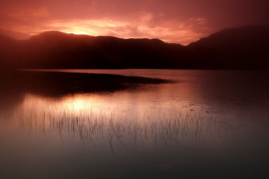 Sunset over lake at Lago de Sanabria Nature Reserve, Zamora, Castilla Leon, Spain