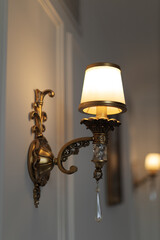 Vintage yellow lamp hanging on the wall